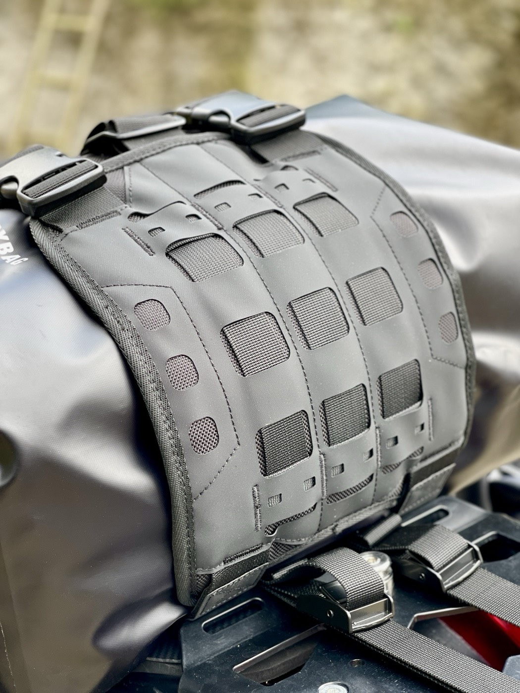 MOLLE slots on the outer top flap securing the top dry bag
